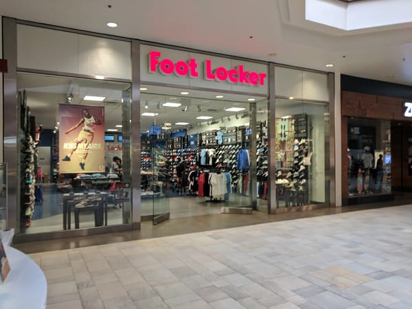 A Foot Locker store entrance in a shopping mall