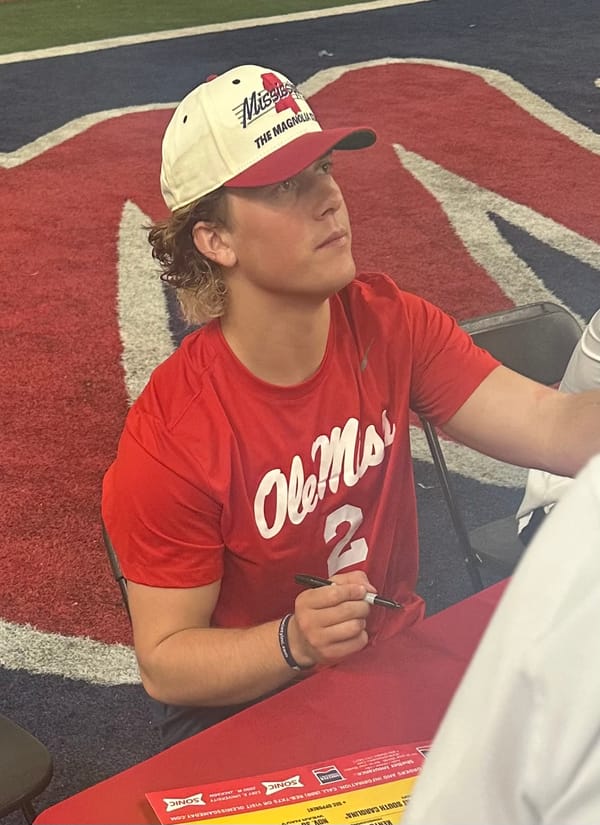 Jaxson Dart signing autographs after the Ole Miss spring game in April 2024