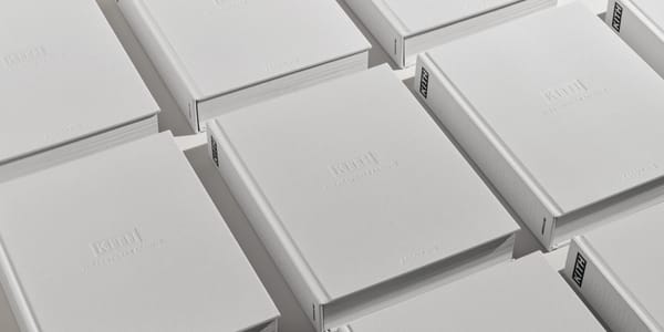 Copies of Kith: The Footwear Archive by Assouline laid out in a grid