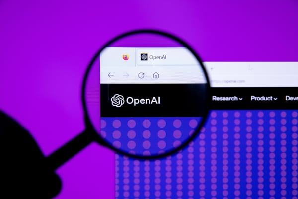 OpenAI logo viewed through a magnifying glass