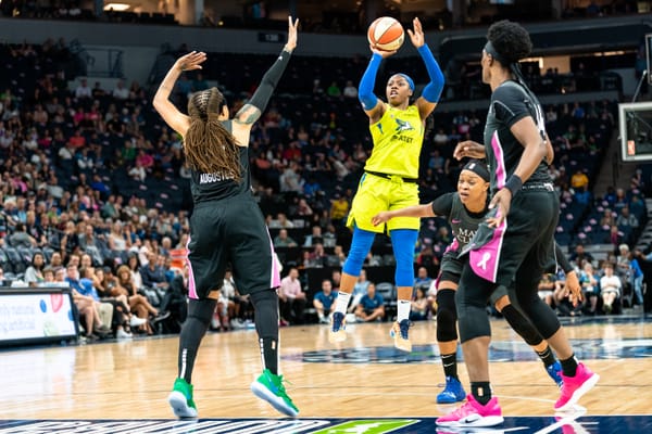 Dallas Wings guard Arike Ogunbowale shoots during a WNBA game.
