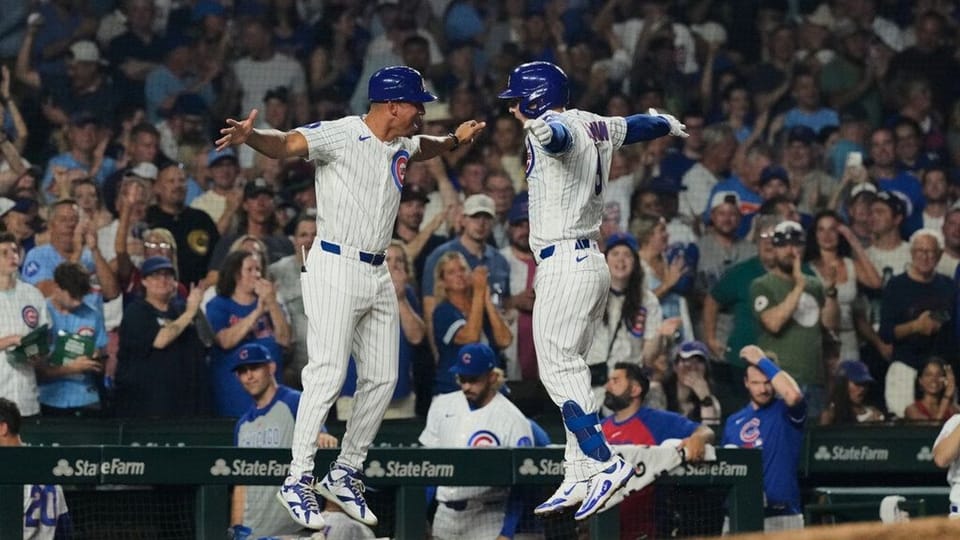 Chicago Cubs and Milwaukee Brewers players at Wrigley Field